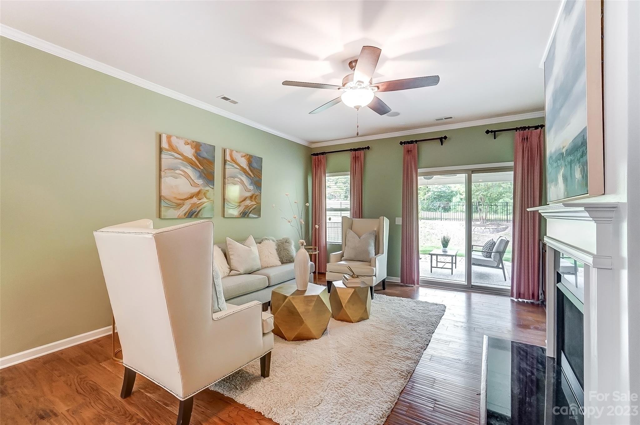 1719 Still River Way Fort Mill, SC 29708 - Photo 9 of 41 a living room with furniture fireplace and a large window