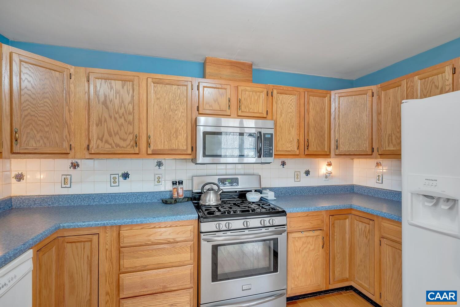 2850 Camp Spring Road Esmont, VA 22937 - Photo 11 of 35 a kitchen with stainless steel appliances granite countertop a sink a stove and a refrigerator