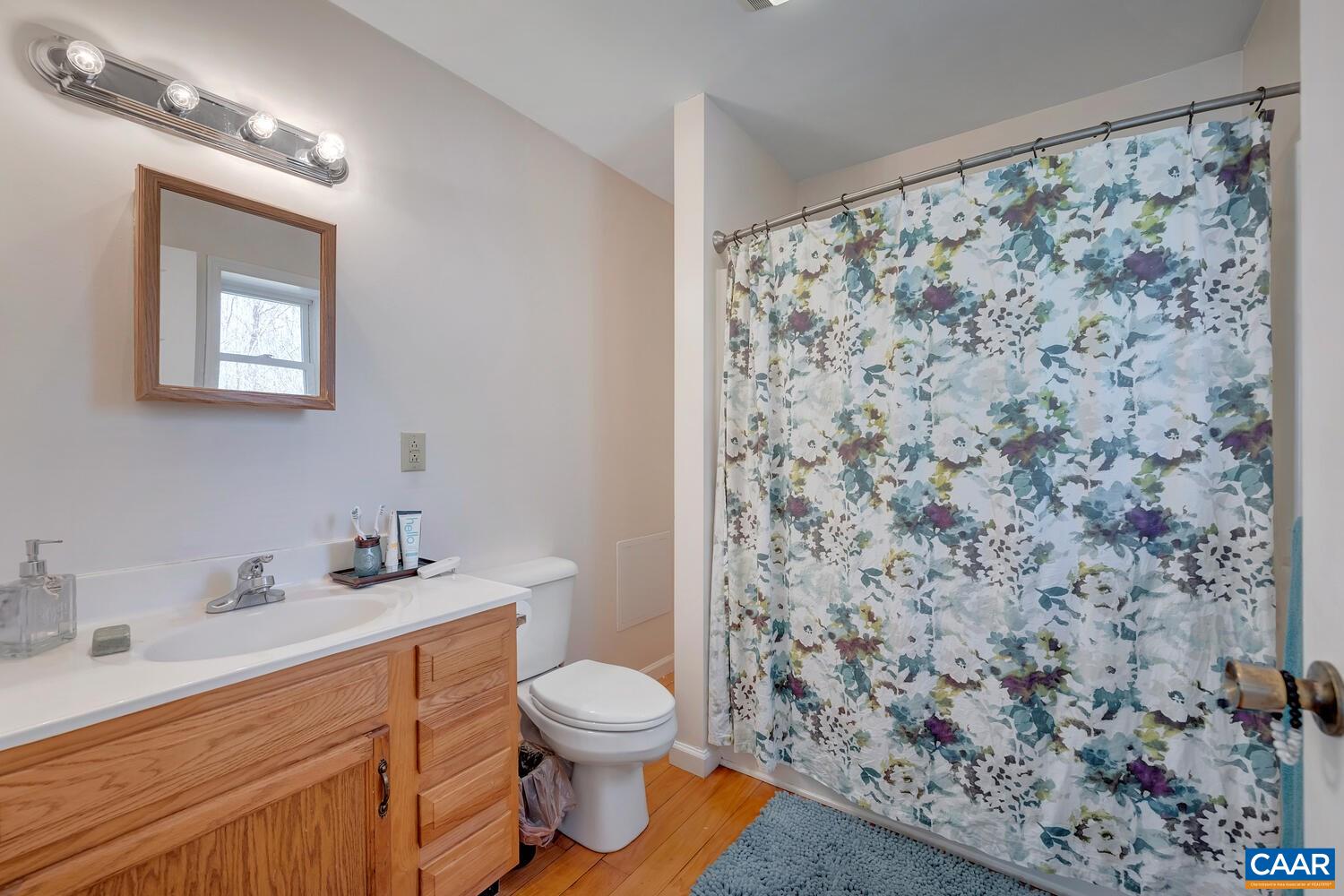 2850 Camp Spring Road Esmont, VA 22937 - Photo 14 of 35 a bathroom with a sink toilet and shower