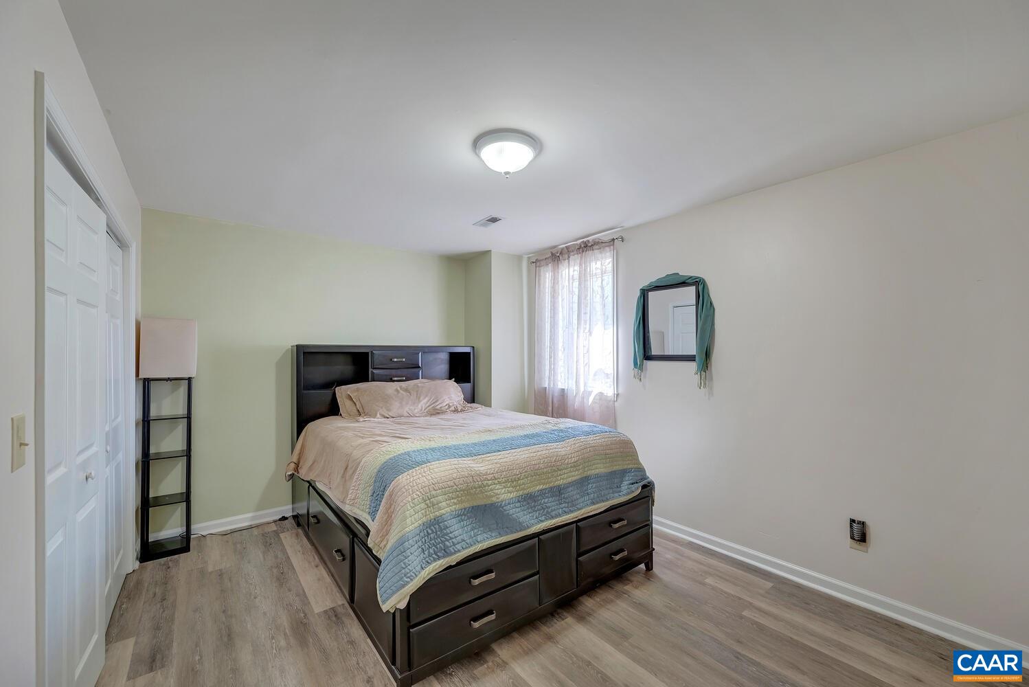 2850 Camp Spring Road Esmont, VA 22937 - Photo 23 of 35 a bedroom with a bed and a night stand