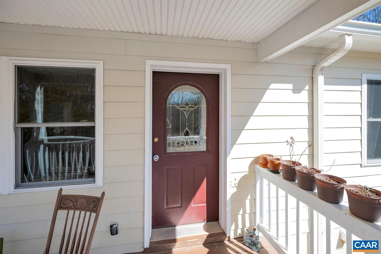 2850 Camp Spring Road Esmont, VA 22937 - Photo 5 of 35 a view of an entryway with a floor to ceiling window