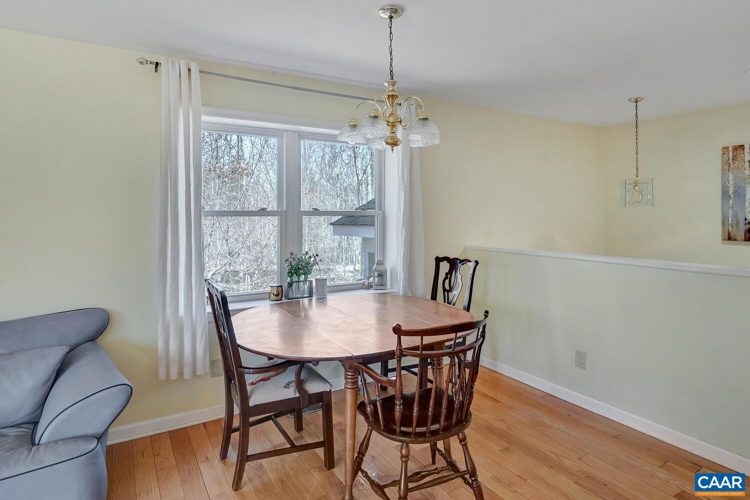2850 Camp Spring Road Esmont, VA 22937 - Photo 8 of 35 a view of a dining room with furniture window and wooden floor