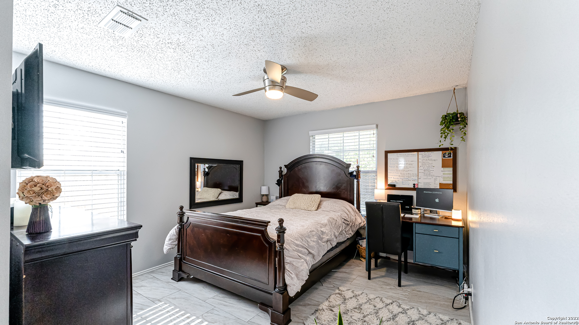 3309 Country View Schertz, TX 78108 - Photo 18 of 27 a bedroom with a bed and wooden floor