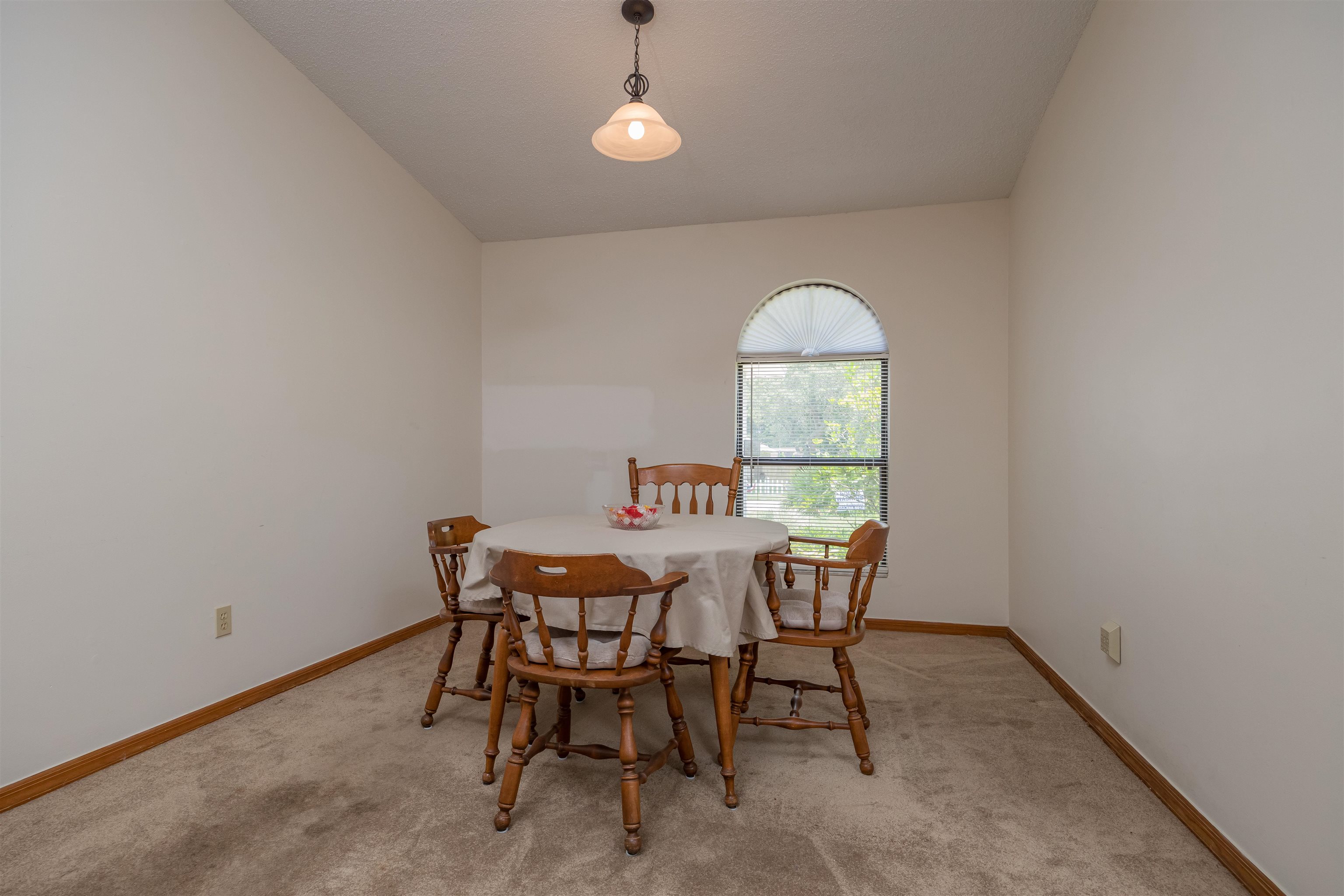 836 Queen Road St. Augustine, FL 32086 - Photo 7 of 26 a dining room with furniture and window