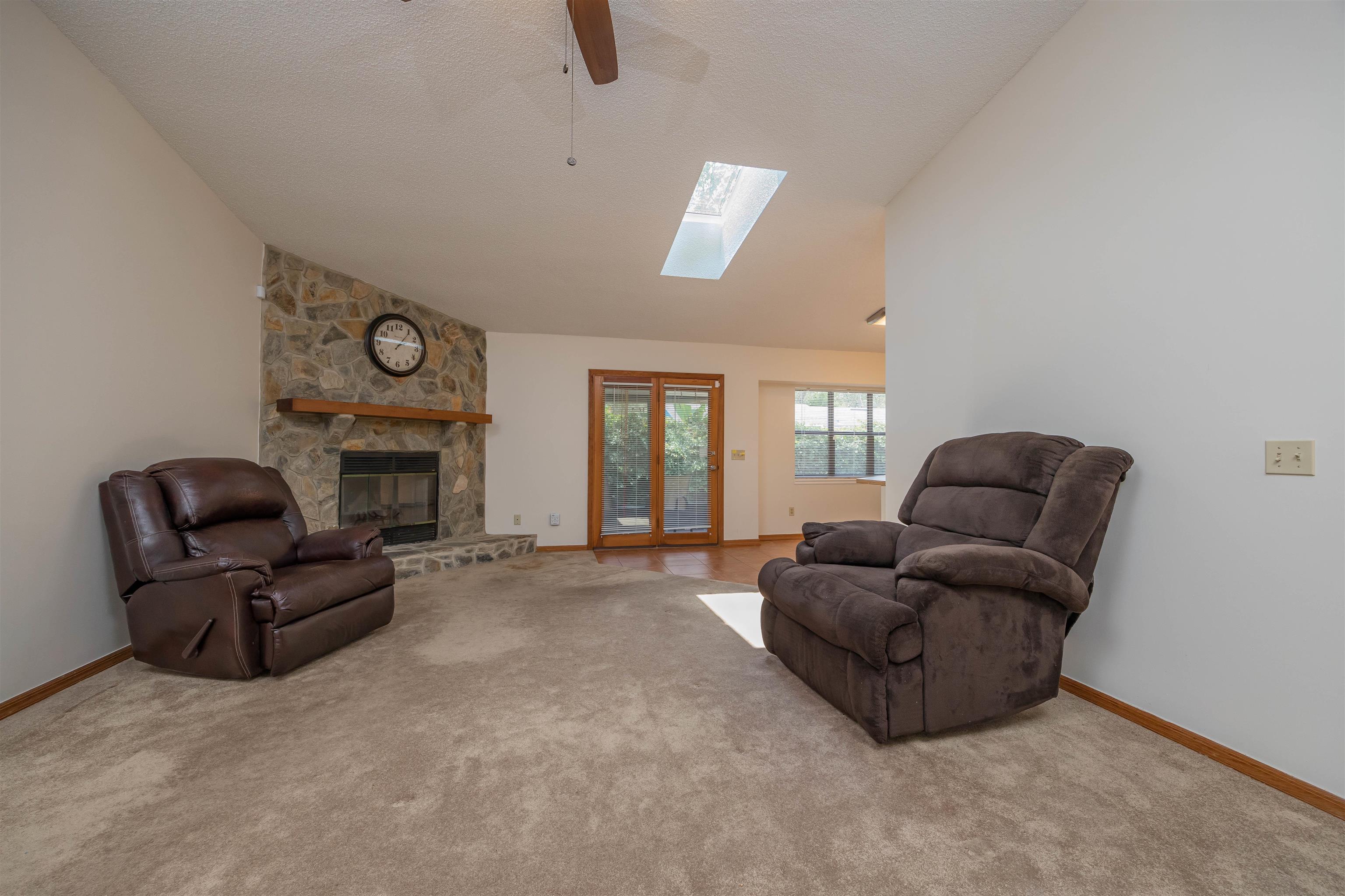 836 Queen Road St. Augustine, FL 32086 - Photo 8 of 26 a living room with furniture and a fireplace