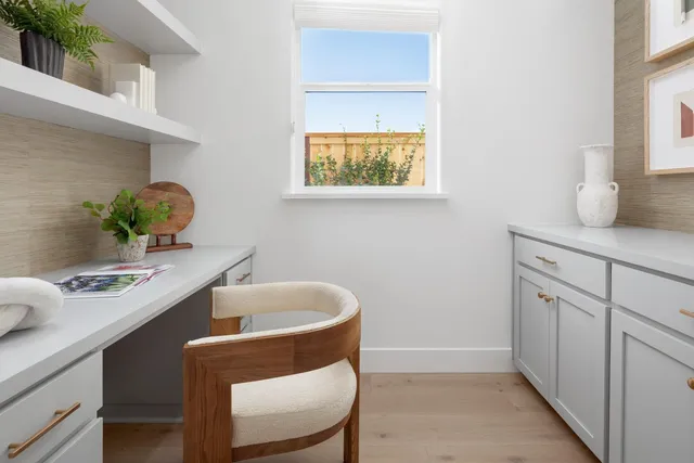 a dining room with table and chairs