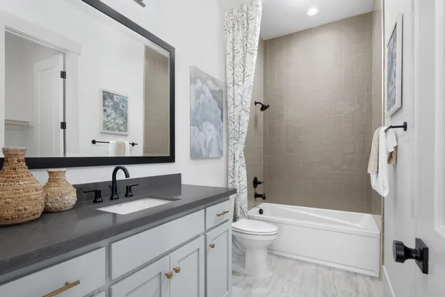 a utility room with sink dryer and washer