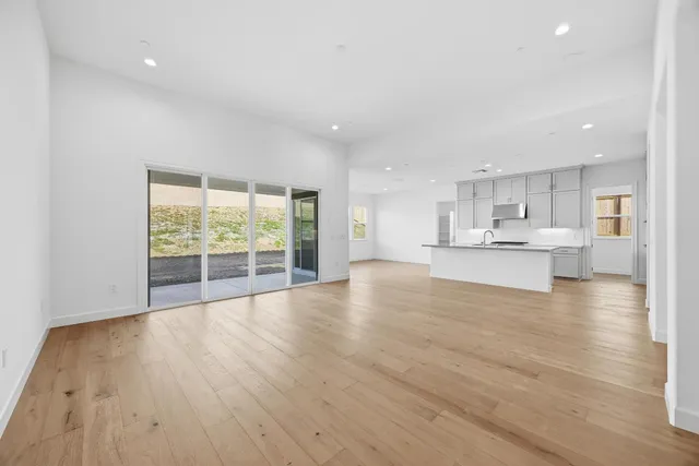 a view of kitchen with wooden floor and windows