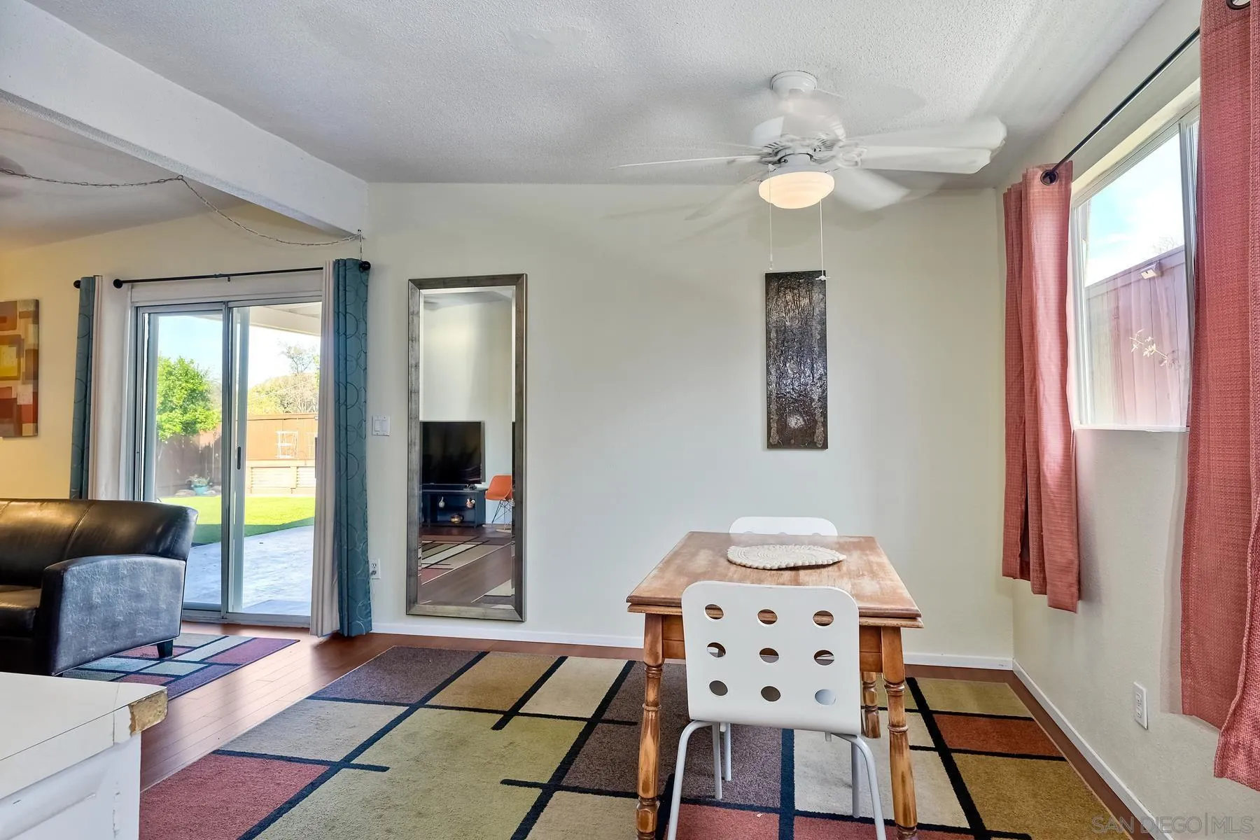 9267 Fairlawn Street Santee, CA 92071 - Photo 14 of 25 a bedroom with a bed and a chandelier
