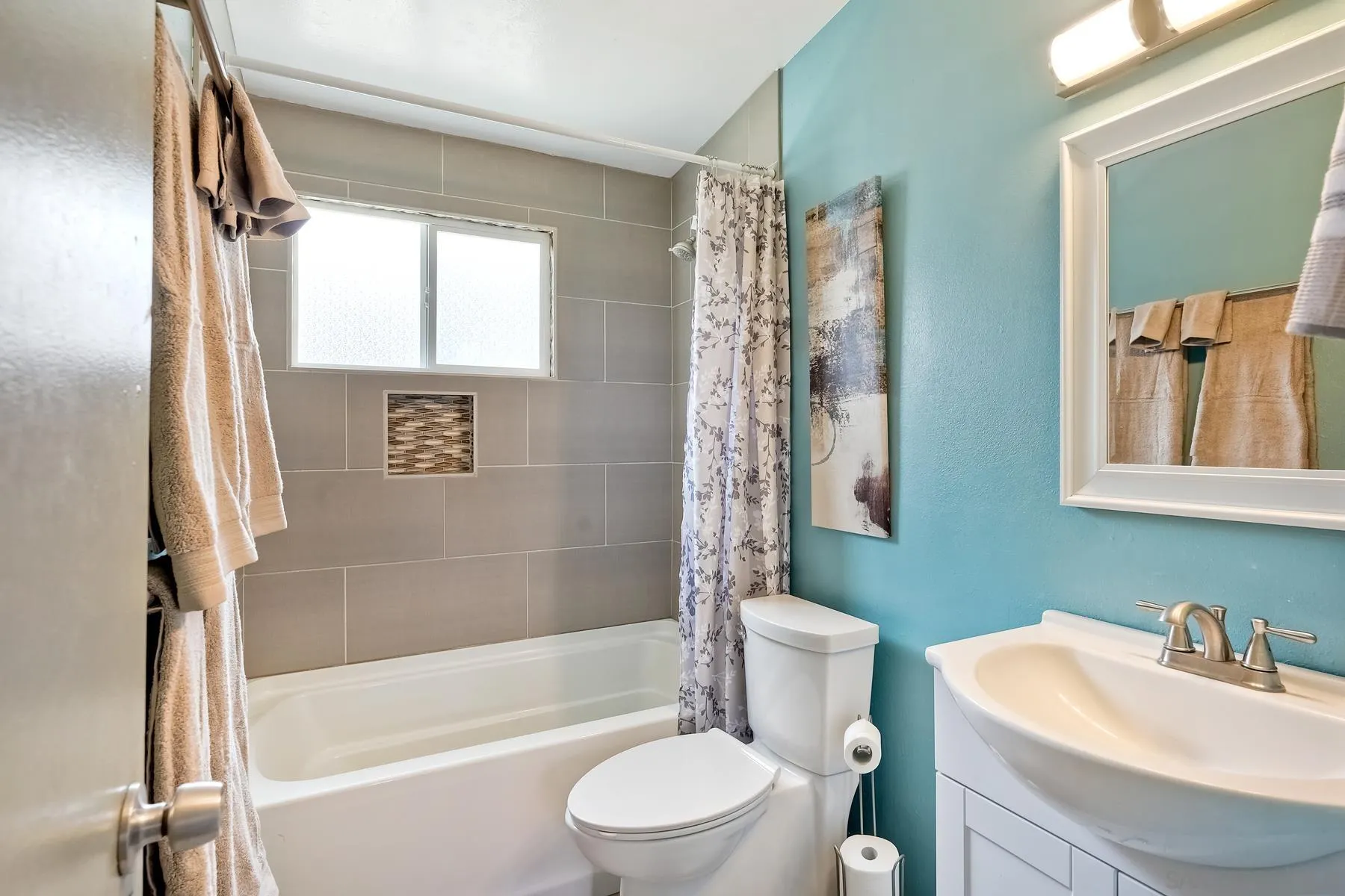 9267 Fairlawn Street Santee, CA 92071 - Photo 15 of 25 a bathroom with a sink toilet and shower