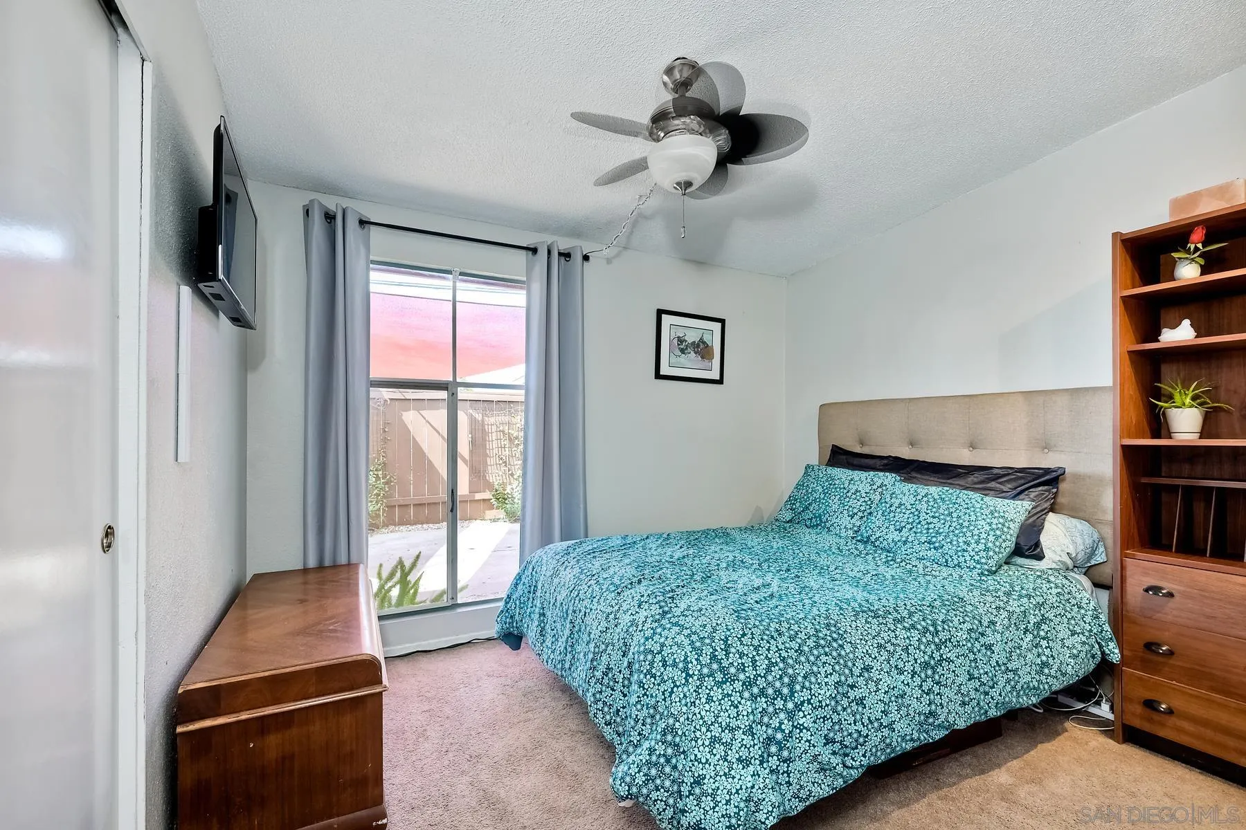 9267 Fairlawn Street Santee, CA 92071 - Photo 18 of 25 a bedroom with a bed and a window