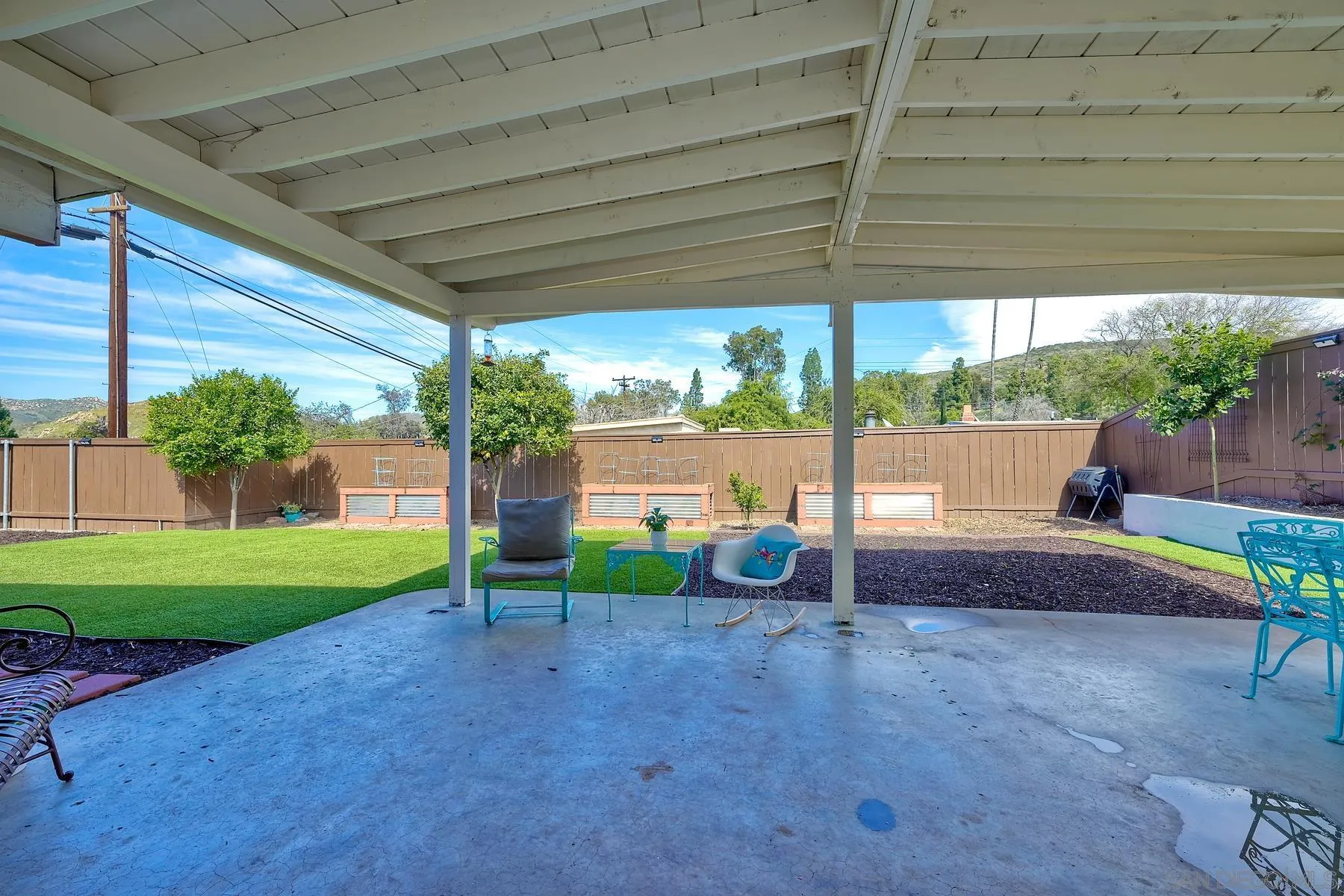 9267 Fairlawn Street Santee, CA 92071 - Photo 19 of 25 a view of backyard with plants and outdoor seating