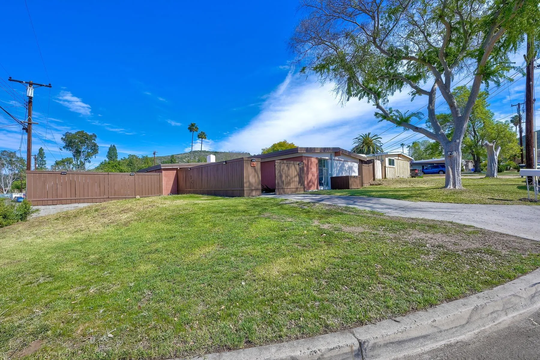 9267 Fairlawn Street Santee, CA 92071 - Photo 2 of 25 a house view with a garden space