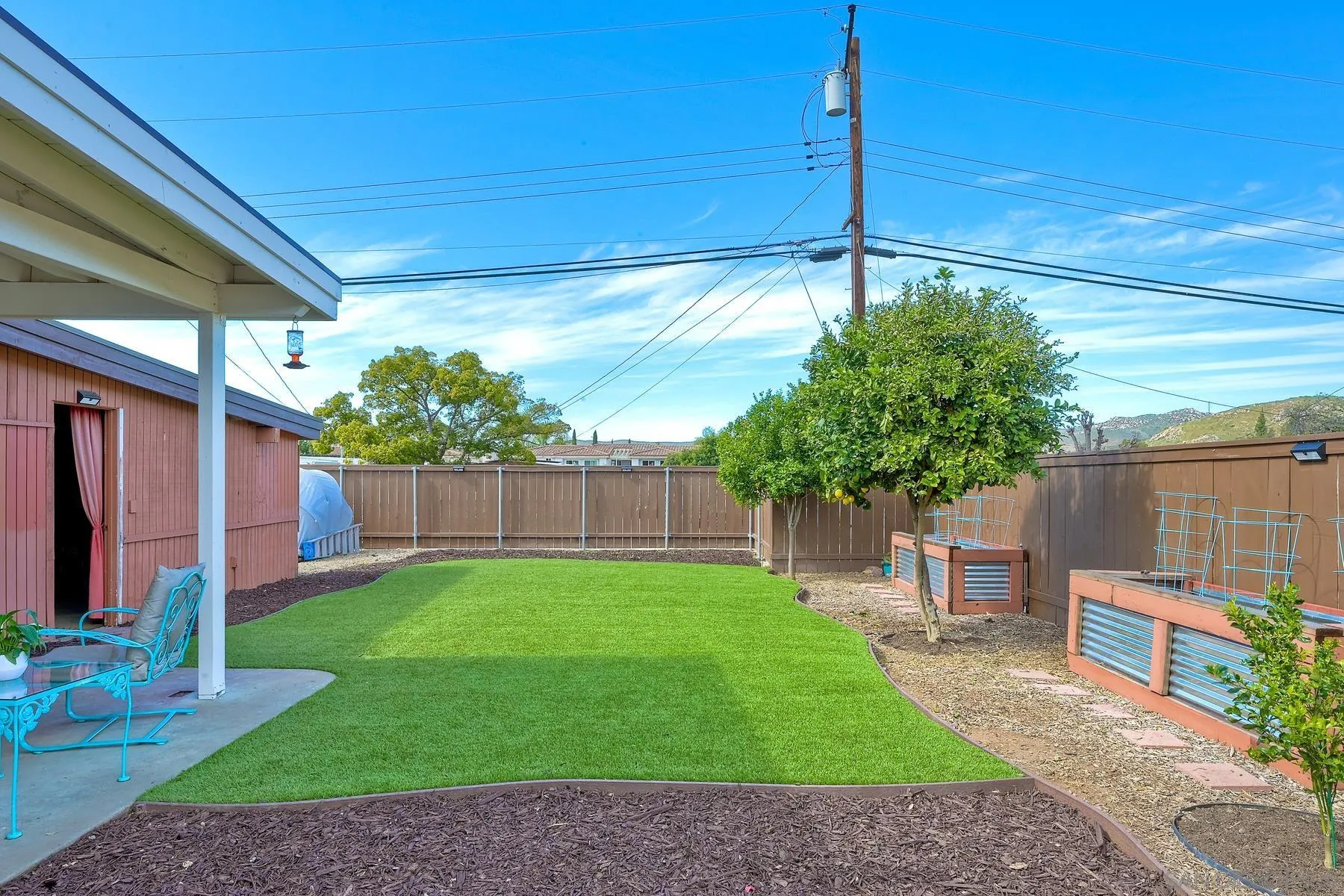 9267 Fairlawn Street Santee, CA 92071 - Photo 22 of 25 a view of a backyard with a garden