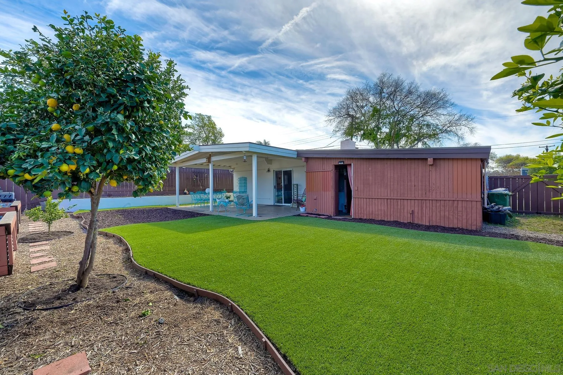 9267 Fairlawn Street Santee, CA 92071 - Photo 23 of 25 a front view of a house with garden