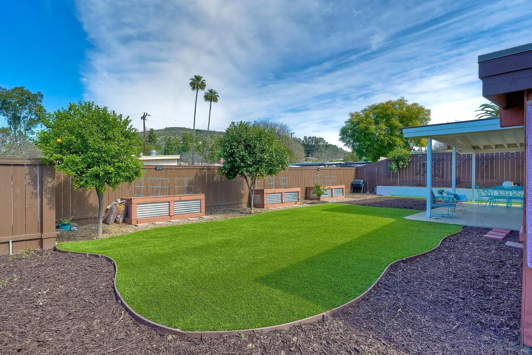 9267 Fairlawn Street Santee, CA 92071 - Photo 24 of 25 a view of a house with a backyard porch and sitting area