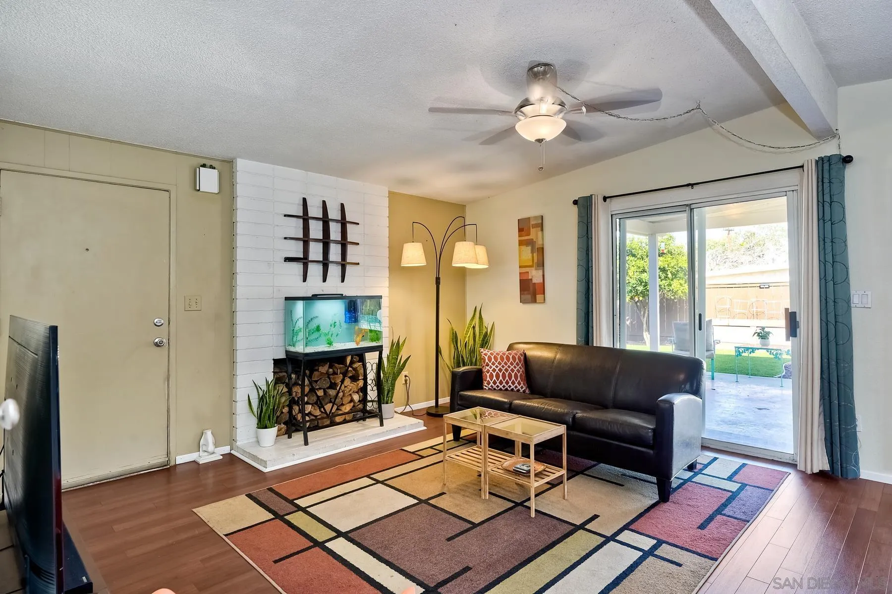 9267 Fairlawn Street Santee, CA 92071 - Photo 7 of 25 a living room with furniture and a fireplace
