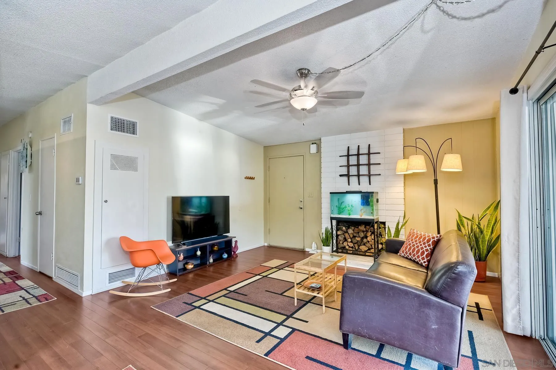 9267 Fairlawn Street Santee, CA 92071 - Photo 9 of 25 a living room with furniture and a flat screen tv