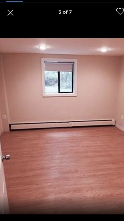 72 Bryon Road, Unit 1 Boston, MA 02467 - Photo 4 of 7 a view of an empty room