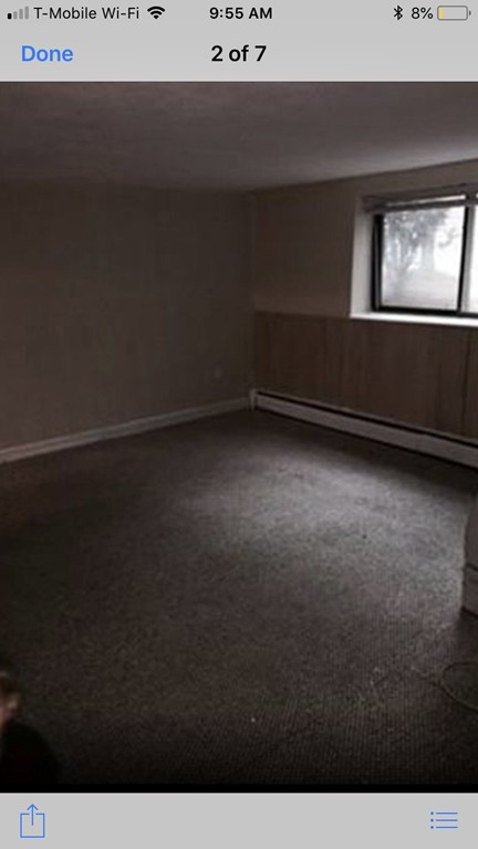 72 Bryon Road, Unit 1 Boston, MA 02467 - Photo 6 of 7 a view of an empty room with a window