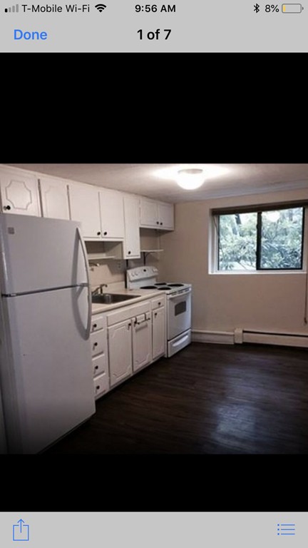 72 Bryon Road, Unit 1 Boston, MA 02467 - Photo 7 of 7 a view of a kitchen with wooden floor