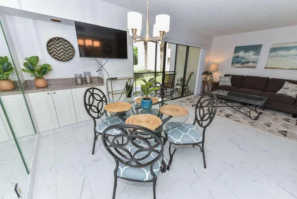 a view of a livingroom and dining room