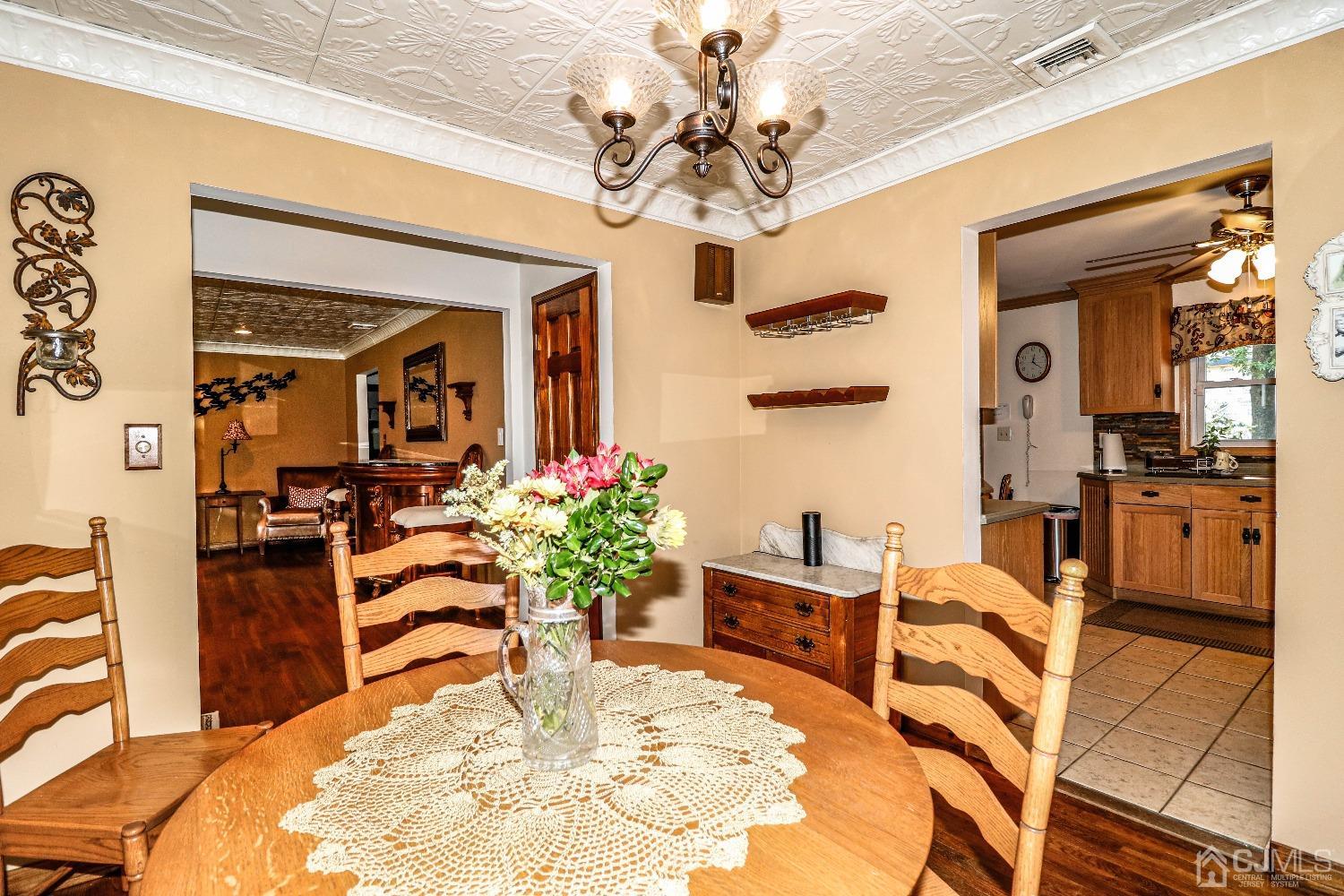 40 Highland Road Colonia, NJ 07067 - Photo 12 of 37 a view of a dining room with furniture and a chandelier