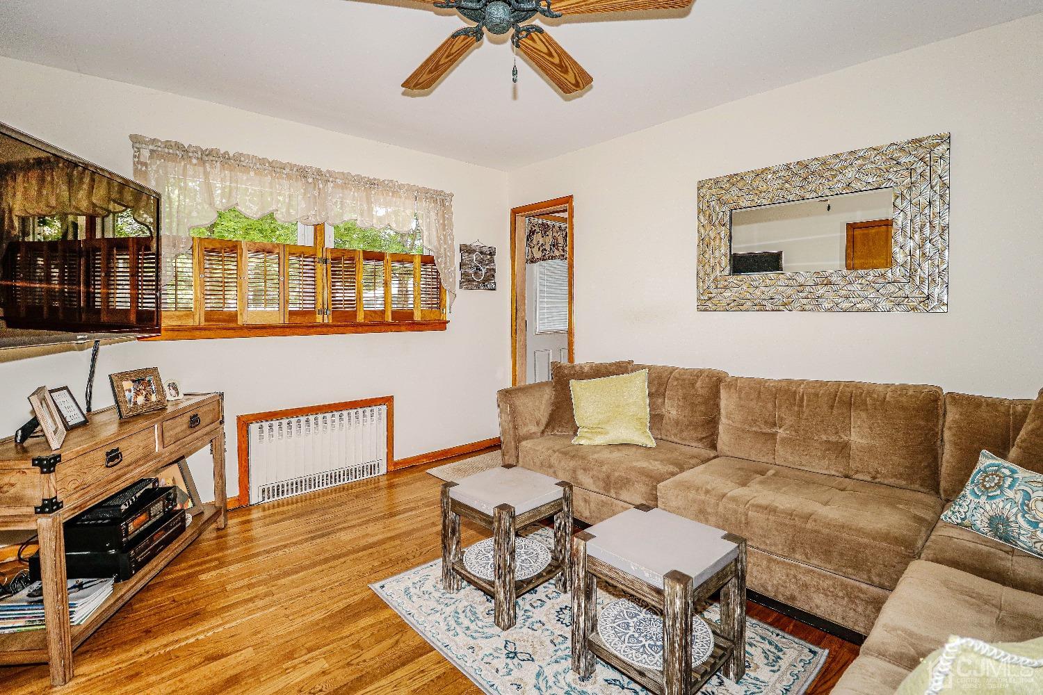 40 Highland Road Colonia, NJ 07067 - Photo 23 of 37 a living room with furniture and a flat screen tv