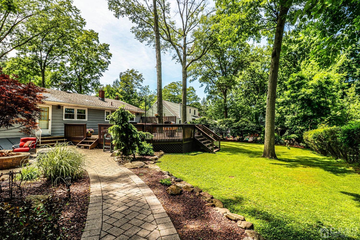 40 Highland Road Colonia, NJ 07067 - Photo 36 of 37 a view of a house with swimming pool and sitting area