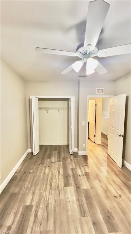 19550 Bowring Park Road, Unit 103 Fort Myers, FL 33967 - Photo 12 of 22 a view of an empty room with window and a kitchen