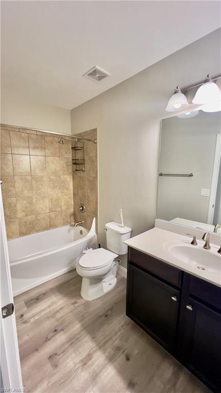 19550 Bowring Park Road, Unit 103 Fort Myers, FL 33967 - Photo 13 of 22 a bathroom with a double vanity sink toilet and shower