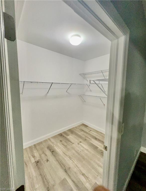 19550 Bowring Park Road, Unit 103 Fort Myers, FL 33967 - Photo 15 of 22 a view of a room with wooden floor