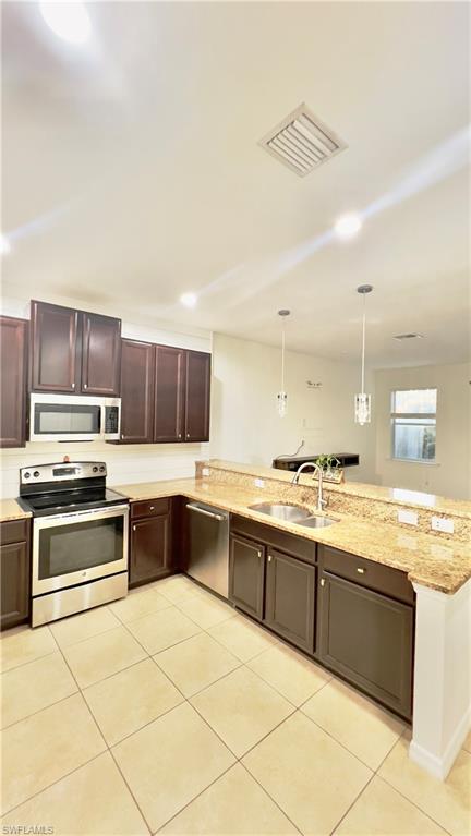 19550 Bowring Park Road, Unit 103 Fort Myers, FL 33967 - Photo 5 of 22 a kitchen with stainless steel appliances granite countertop a sink and cabinets