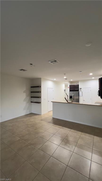 19550 Bowring Park Road, Unit 103 Fort Myers, FL 33967 - Photo 7 of 22 a view of kitchen with cabinets and a stove top oven
