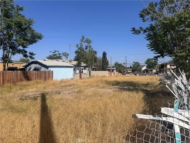 a view of a water fountain and a big yard