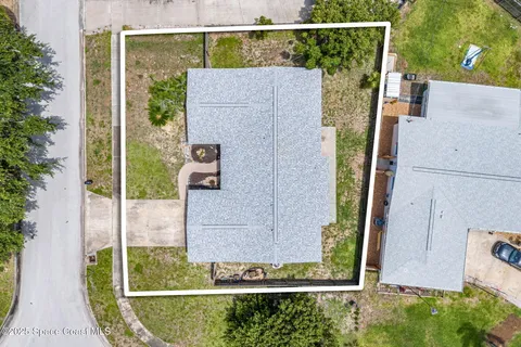 aerial view of a house with a swimming pool