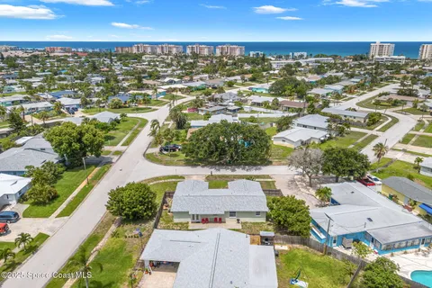 an aerial view of a house with a swimming pool yard and outdoor seating