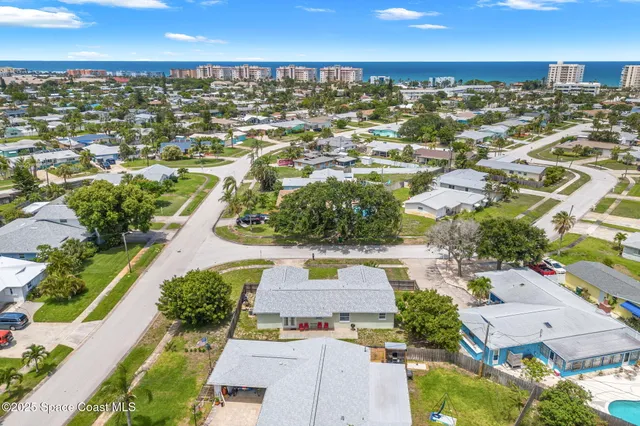 an aerial view of a house with a swimming pool yard and outdoor seating