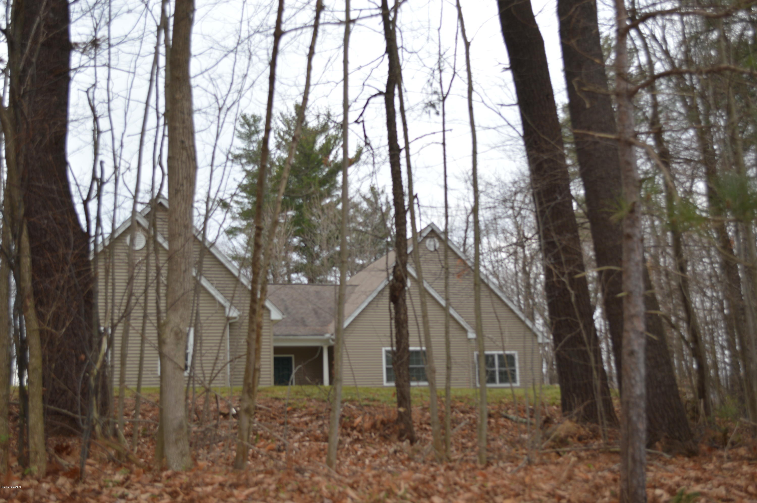 2307 Jacobs Ladder Road Becket, MA 01223 - Photo 11 of 55 front view of a house with a trees