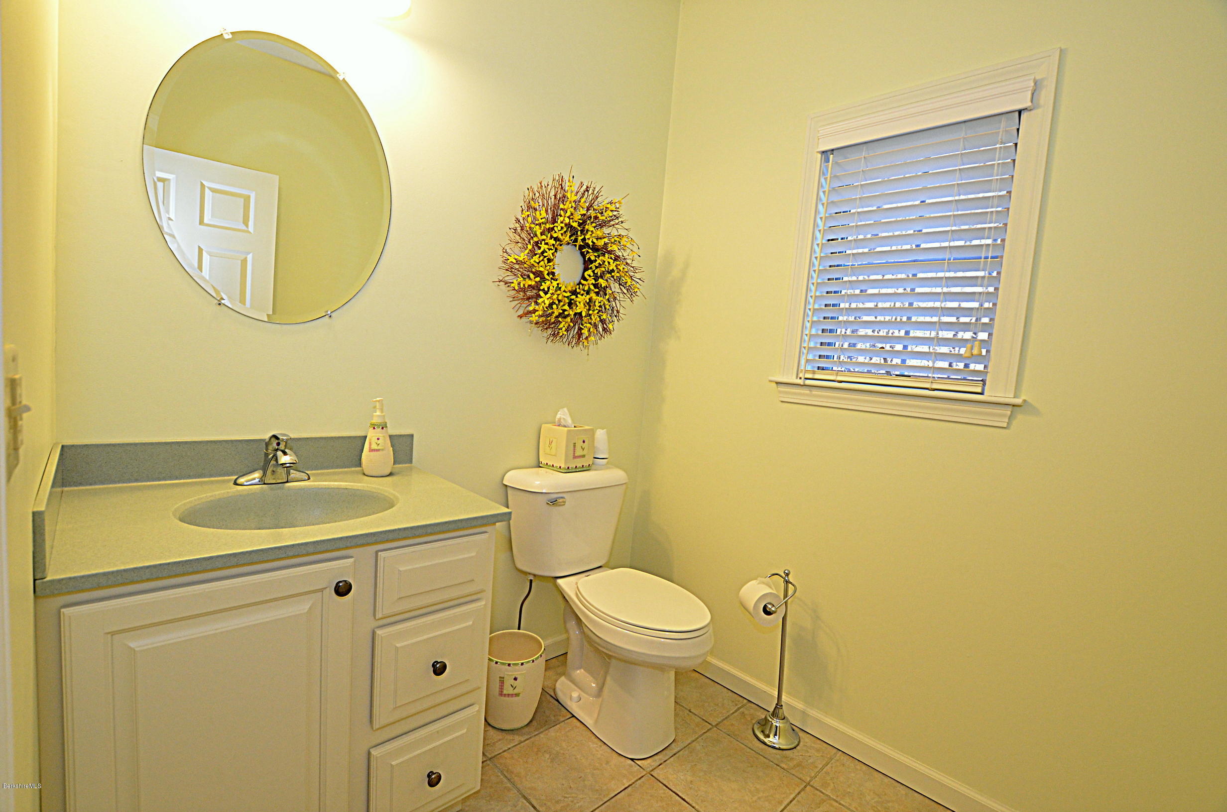 2307 Jacobs Ladder Road Becket, MA 01223 - Photo 20 of 55 a bathroom with a toilet sink and mirror