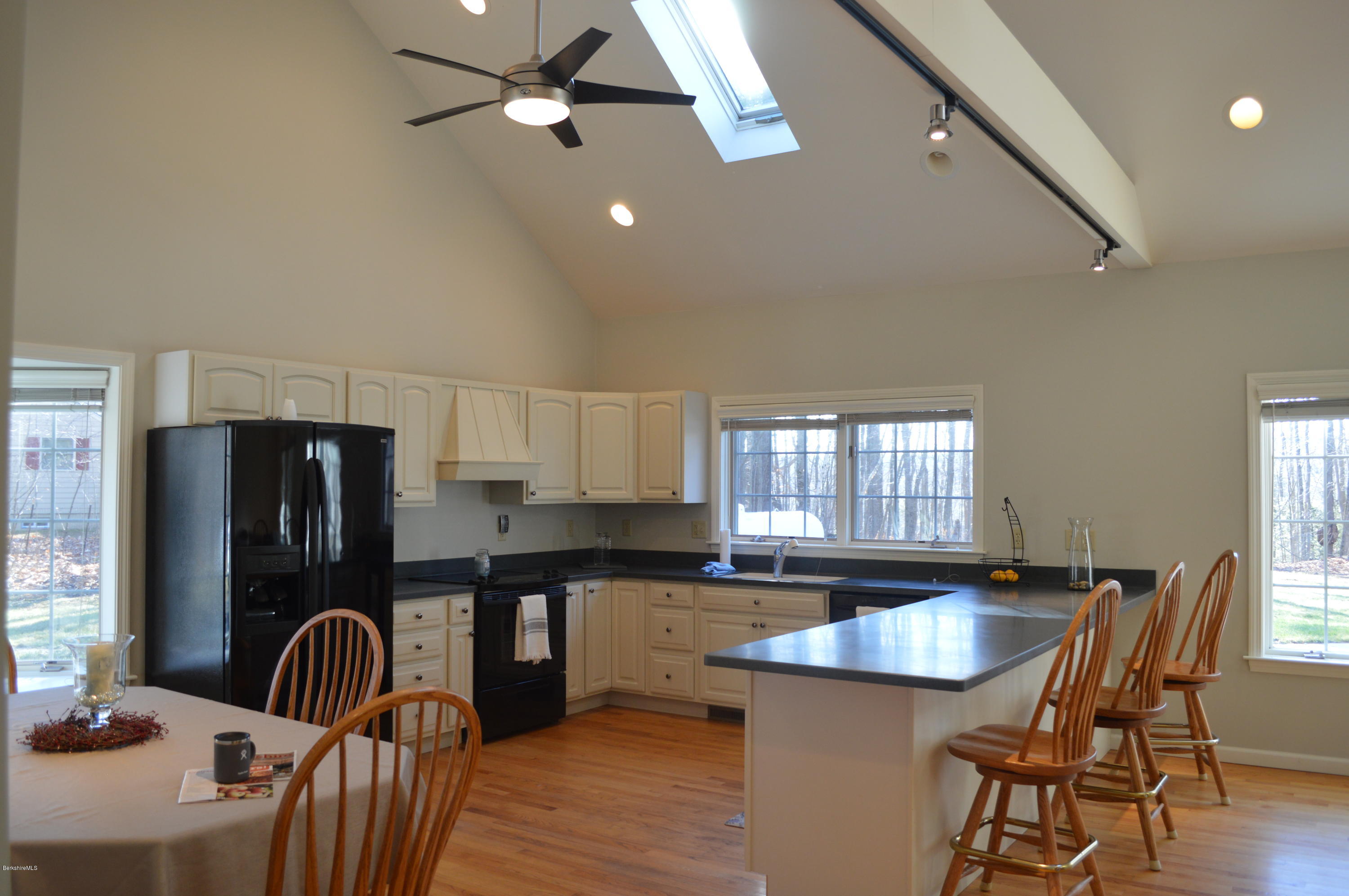 2307 Jacobs Ladder Road Becket, MA 01223 - Photo 4 of 55 a kitchen with granite countertop stainless steel appliances a dining table chairs and granite counter tops