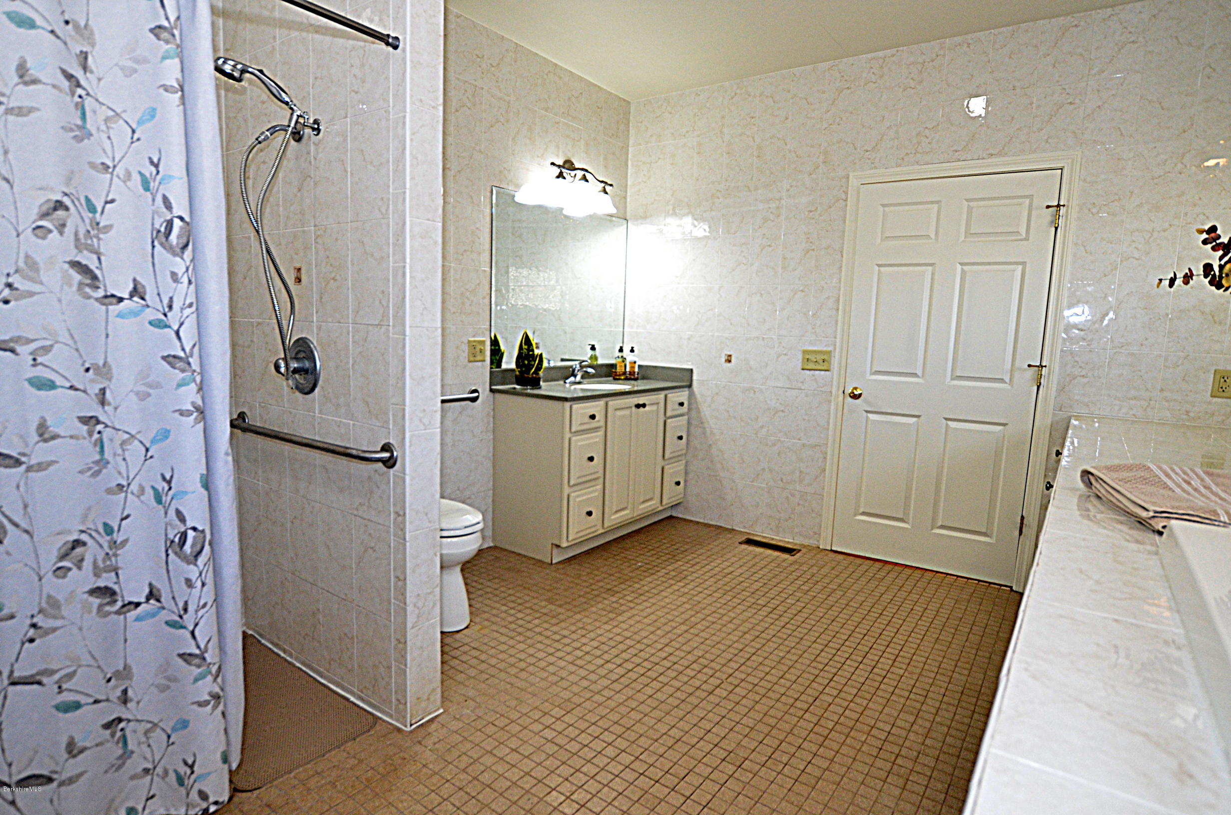 2307 Jacobs Ladder Road Becket, MA 01223 - Photo 31 of 55 a bathroom with a granite countertop sink a toilet and shower