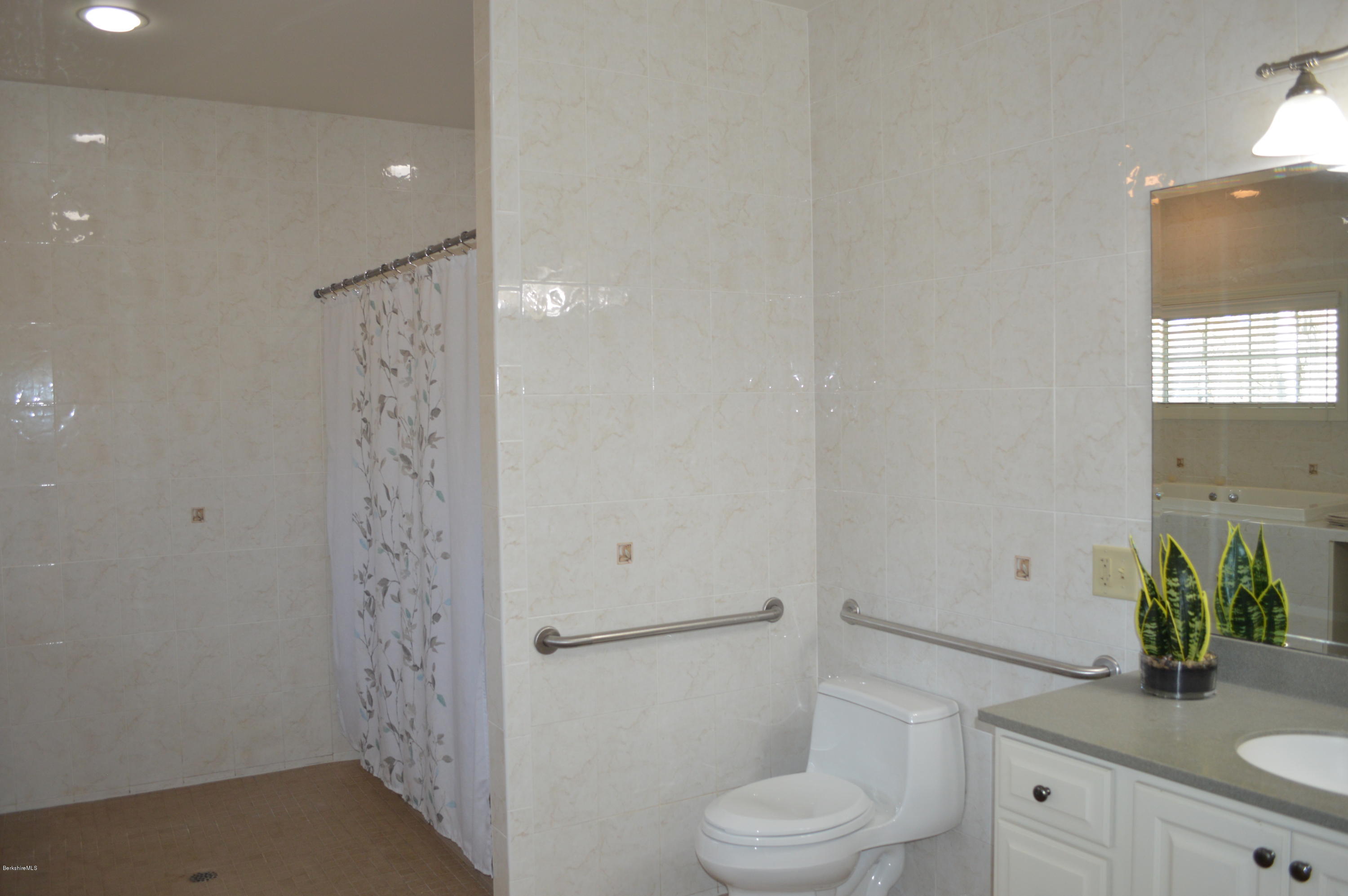 2307 Jacobs Ladder Road Becket, MA 01223 - Photo 34 of 55 a bathroom with a granite countertop sink toilet and shower