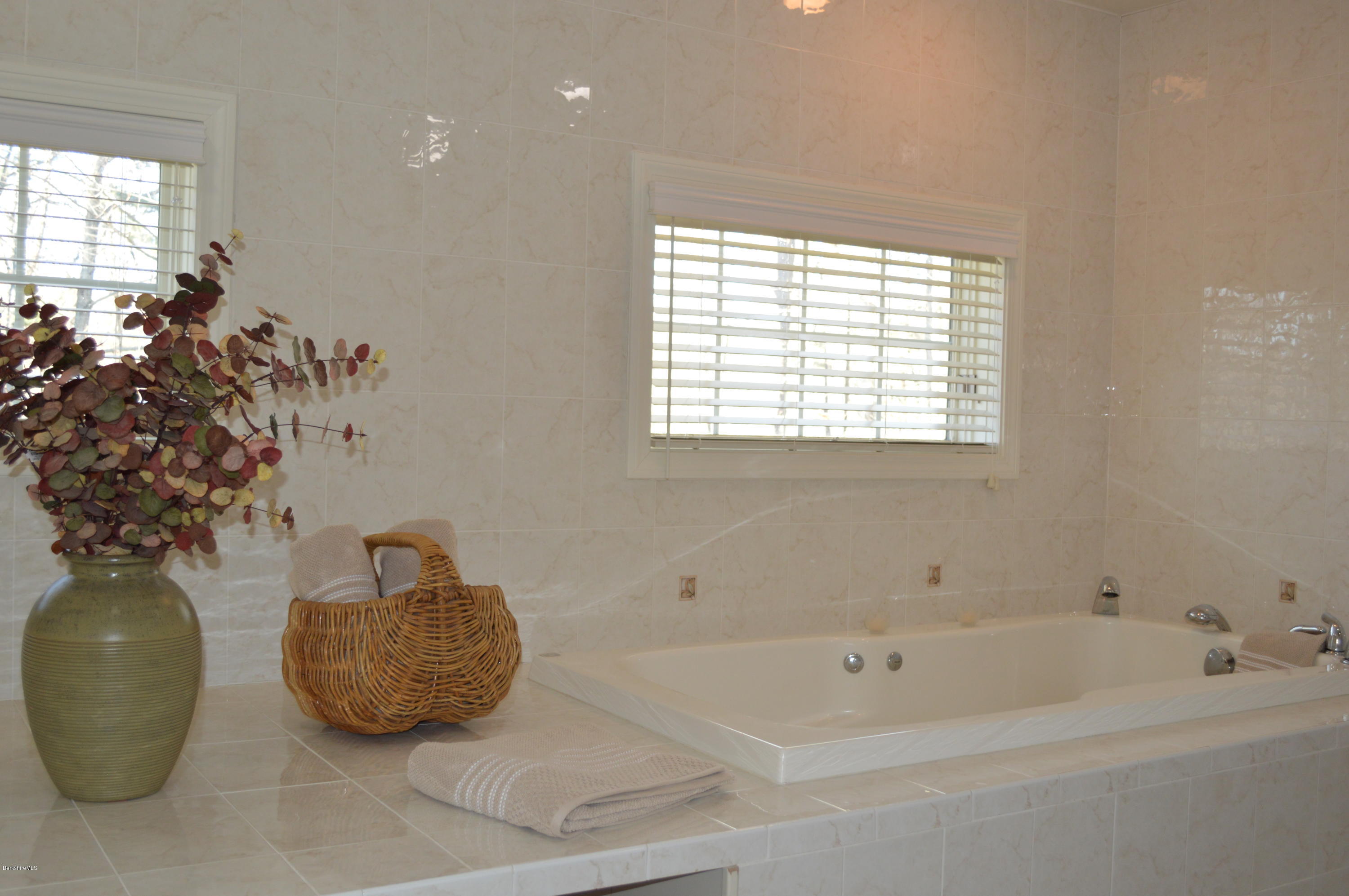 2307 Jacobs Ladder Road Becket, MA 01223 - Photo 36 of 55 a bath tub sitting next to a window
