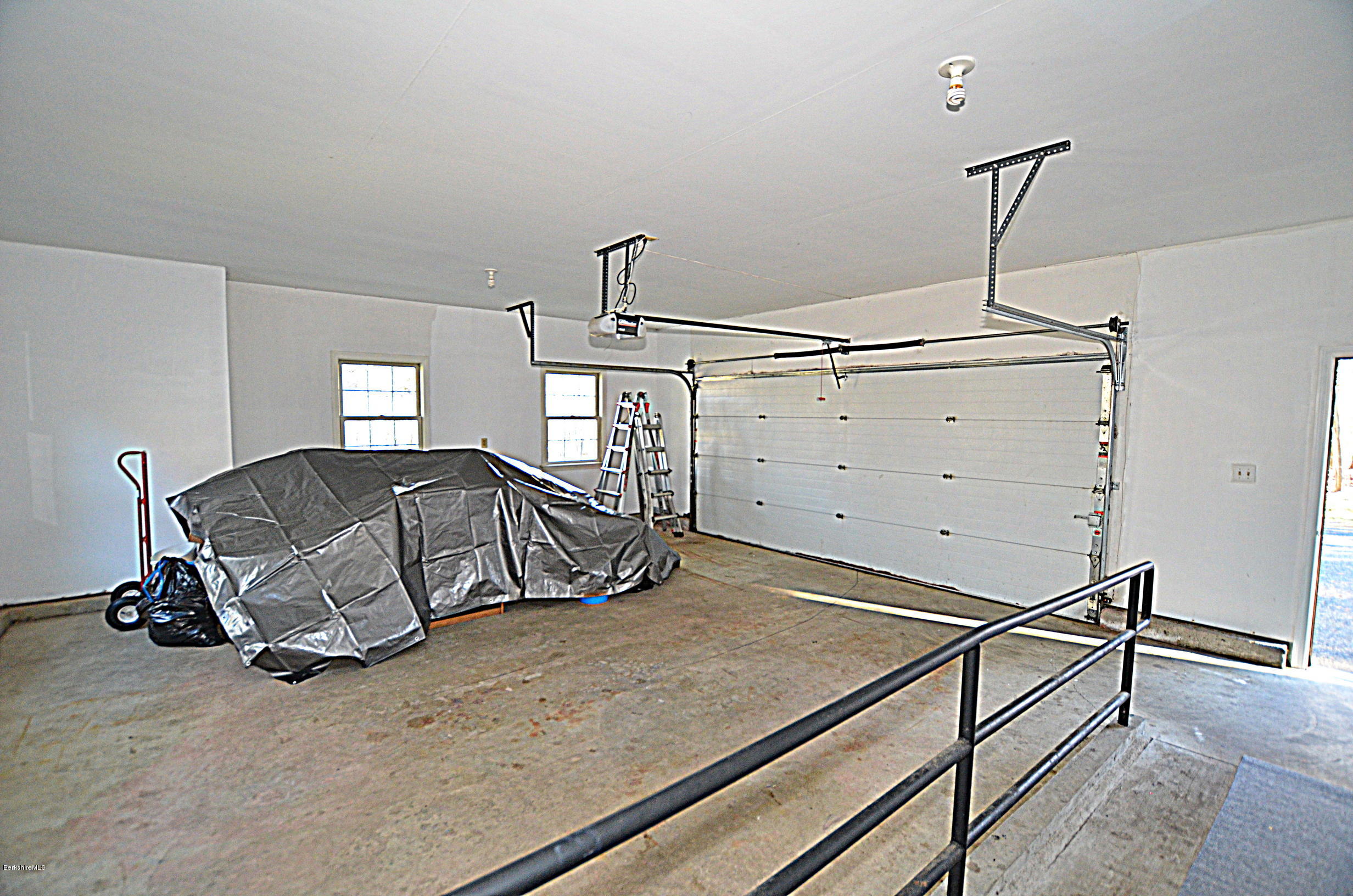 2307 Jacobs Ladder Road Becket, MA 01223 - Photo 40 of 55 a bedroom with a bed and cabinets