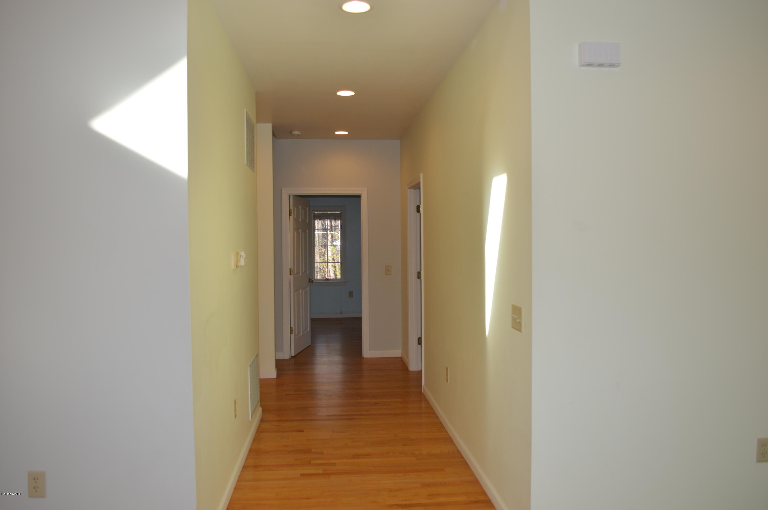 2307 Jacobs Ladder Road Becket, MA 01223 - Photo 43 of 55 a view of a hallway with wooden floor