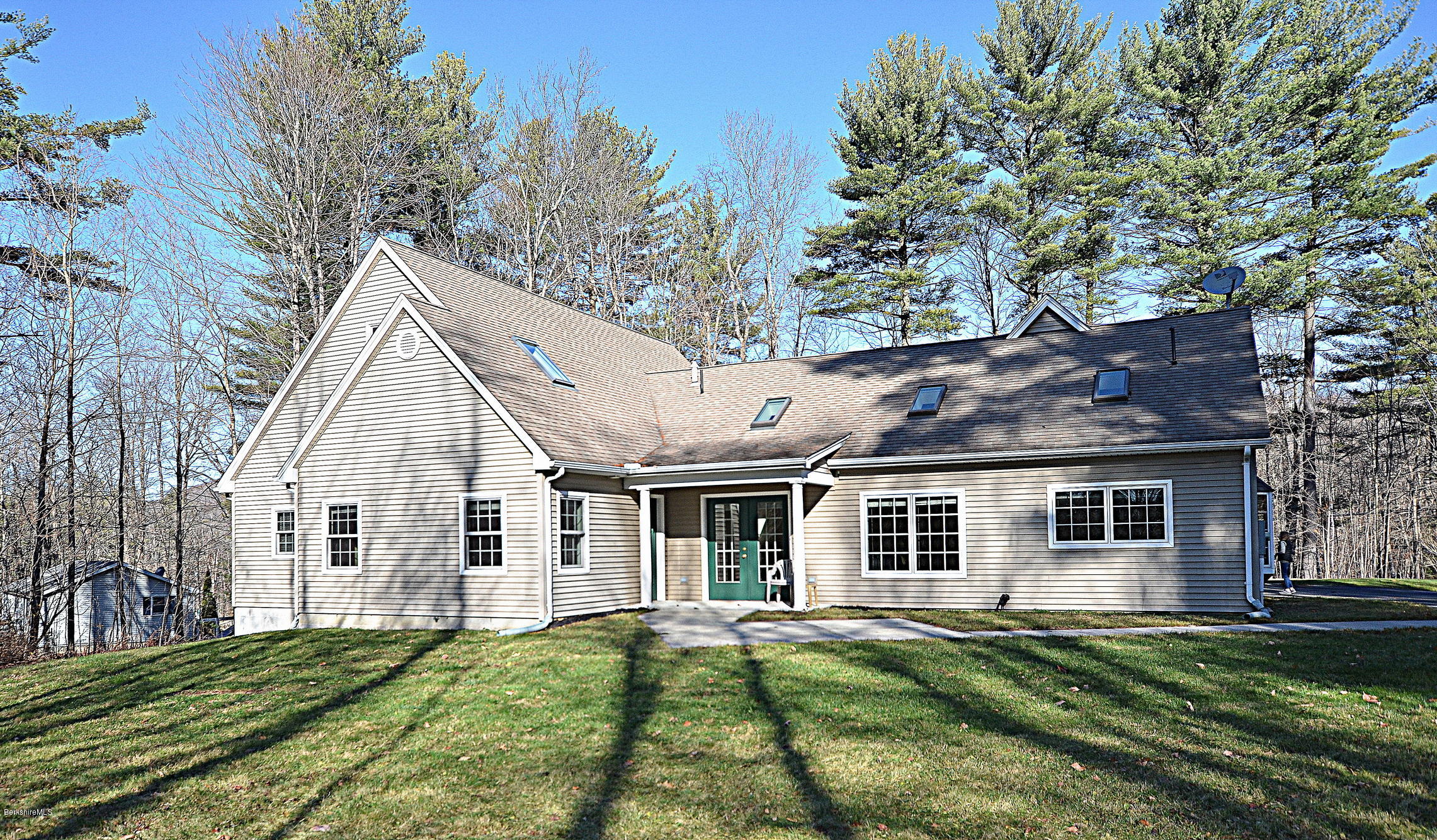 2307 Jacobs Ladder Road Becket, MA 01223 - Photo 6 of 55 a view of a yard in front of a house with a large tree