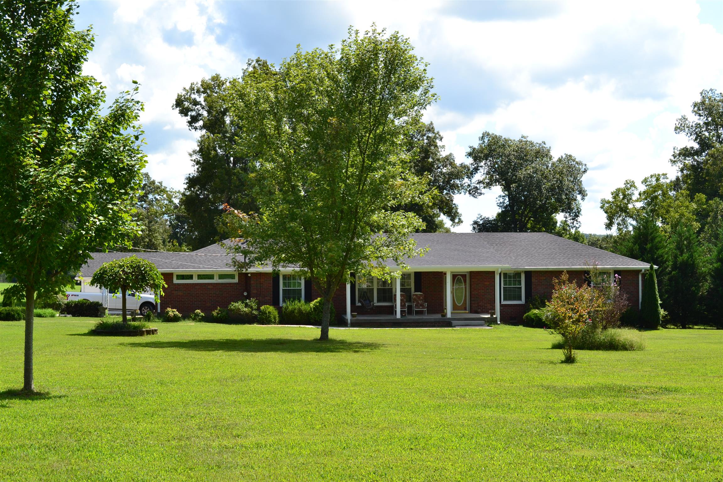 340 Eastover Road Lebanon, TN 37090 - Photo 1 of 20 A SHOWPLACE WITH 5.68 ACRE MINI FARM W 38X60 METAL BARN W CONCRETE FLOOR, WKSP 32X16 APT STORM SHELTER 3 BR 2BA W SUNROOM, HDWD TILE SHOWER BEAUTIFUL YARD WITH TREES