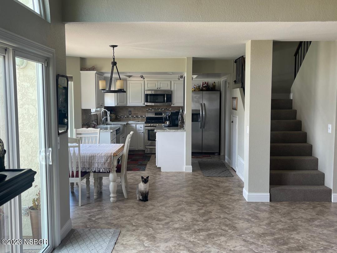 1108 Honeysuckle Way Lompoc, CA 93436 - Photo 15 of 54 a view of kitchen with furniture and refrigerator