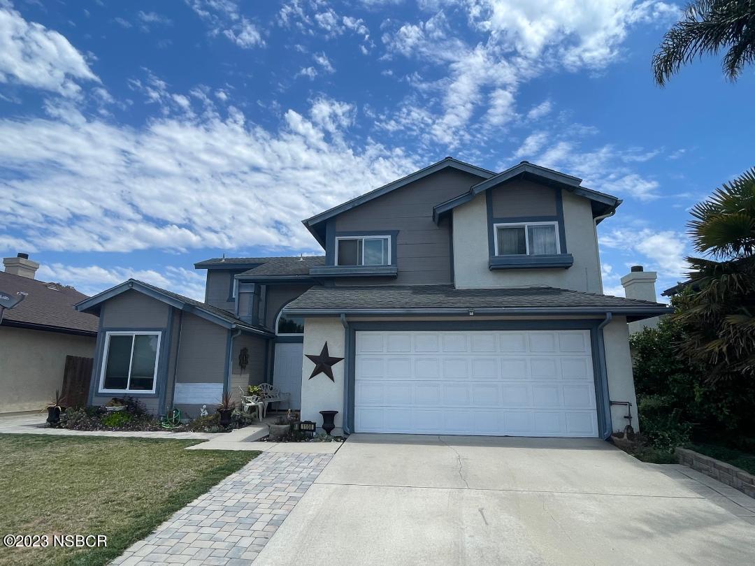 1108 Honeysuckle Way Lompoc, CA 93436 - Photo 2 of 54 a front view of a house with a yard and garage
